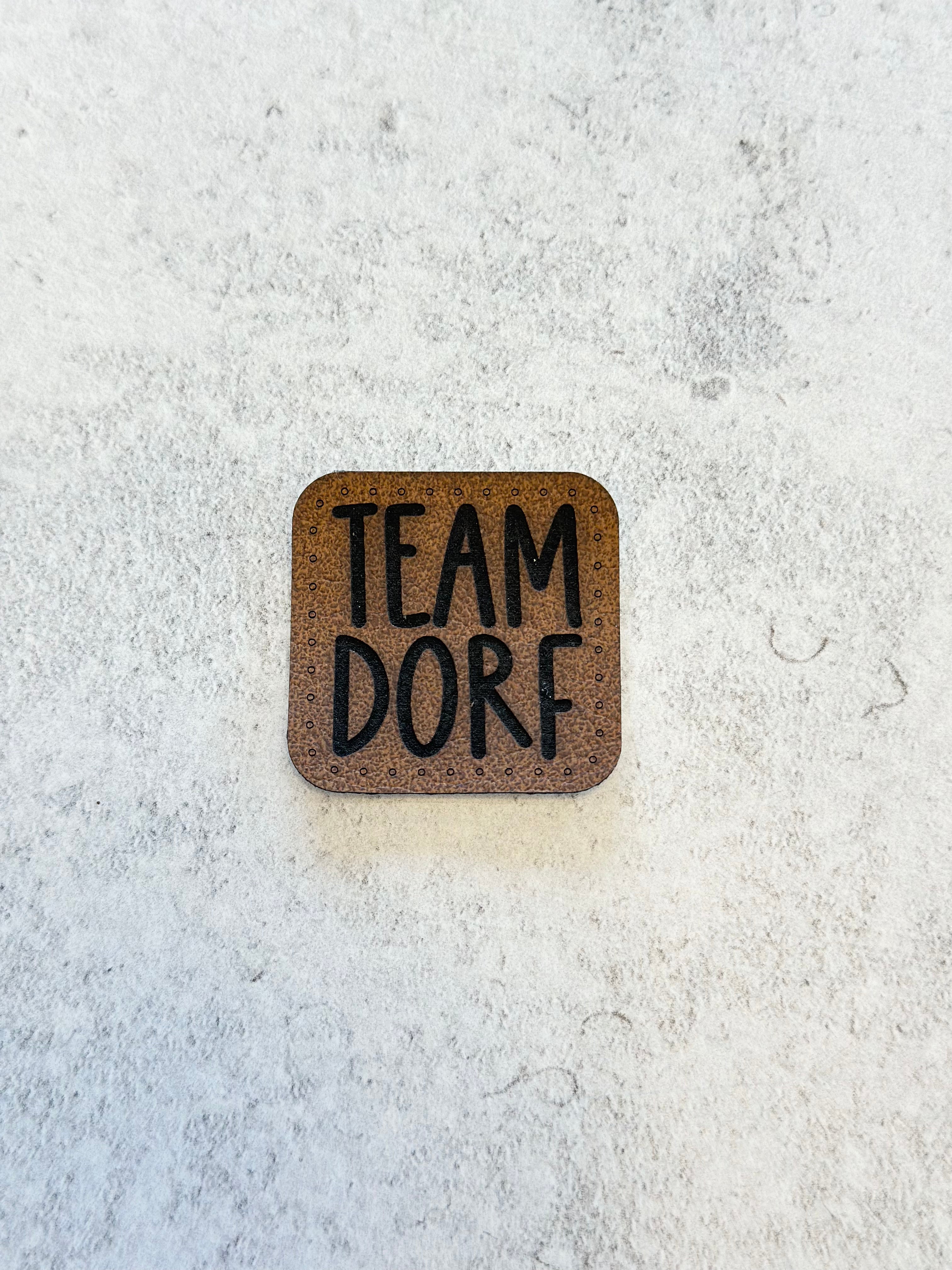Label „Team Dorf“